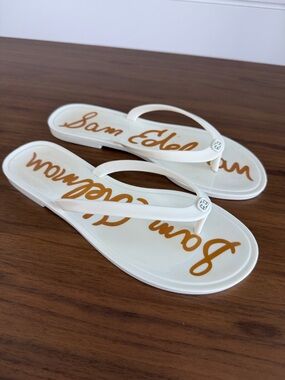 Sam Edelman White Flip Flop Sandals with Gold Script